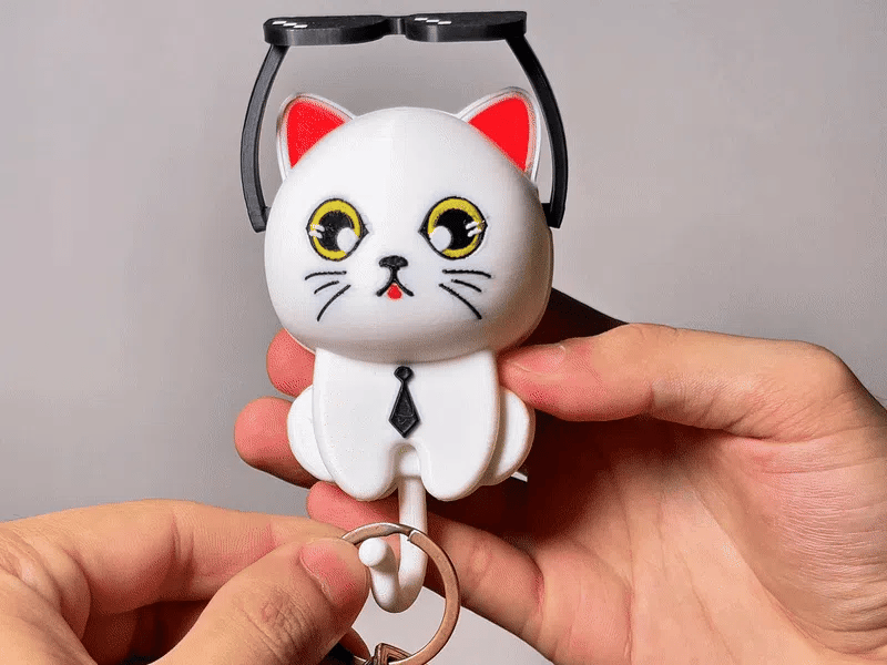 Colgador gato con anteojos