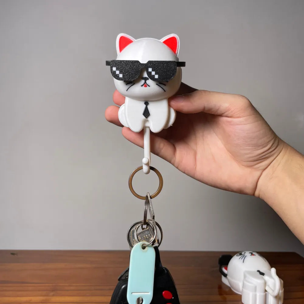 Colgador gato con anteojos