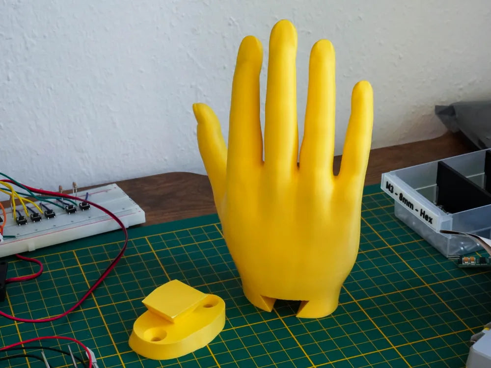 Soporte colgador con forma de mano